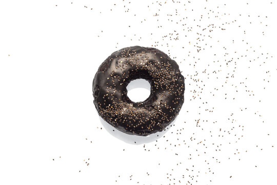 black bagel with poppy seeds isolated on white background