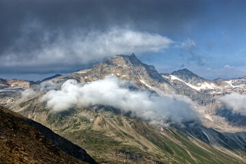 View to the mountain Hoher Sonnblick with clouds, High Tauern National Park, Austrian Alps, Europe