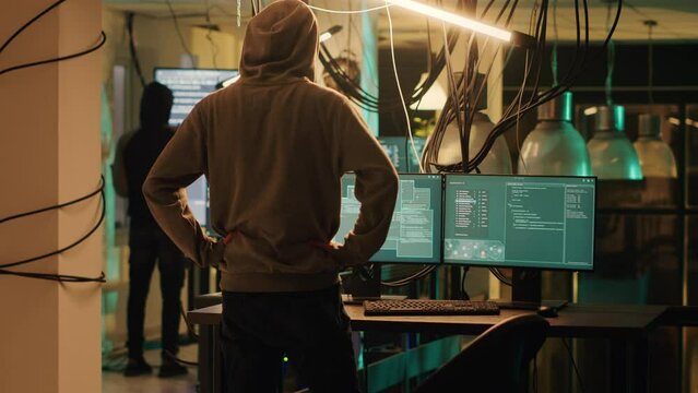 Timelapse of spies team planning cryptojacking and cyberattack, using malware and trojan virus to crack firewall encryption. Criminals hacking computer system on fast forward speed.