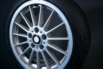 old car wheels titanium rims long exposure video on dark background spinning motion simulation