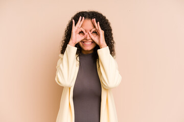 Young african american curly woman isolated excited keeping ok gesture on eye.