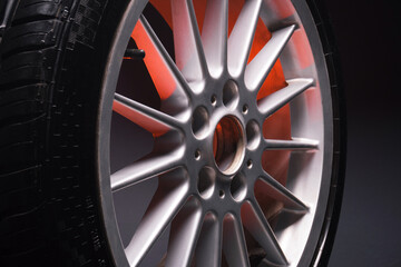 old car wheels titanium rims long exposure video on dark background spinning motion simulation