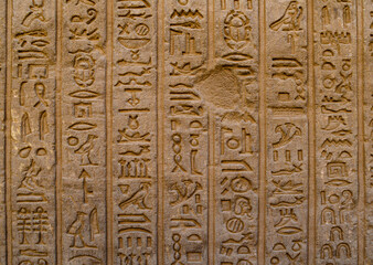 Deeply carved hieroglyphs on inner wall at Dendera Temple, Egypt