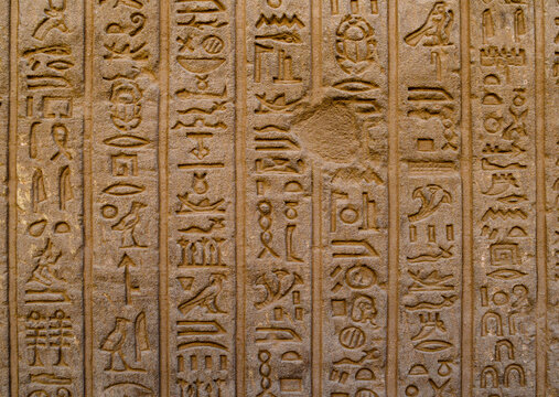Deeply carved hieroglyphs on inner wall at Dendera Temple, Egypt