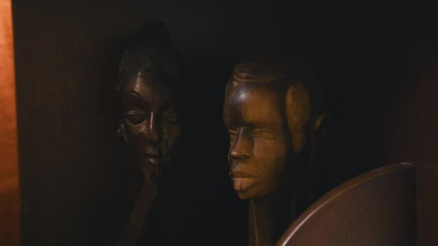 Black Stock Footage of historic African Art, Masks, Artifacts, and Sculptures in a home museum showcasing the diversity of African descendents, cultures, and creativity