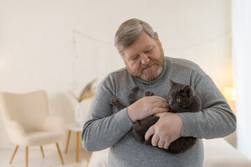 elderly people take care of cats and enjoy them at home