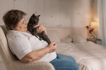 elderly people take care of cats and enjoy them at home