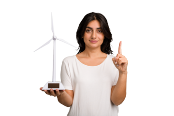 Young Indian woman holding a small wind energy mill isolated showing number one with finger.