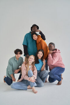 Group of multiracial friends in colorful outfits