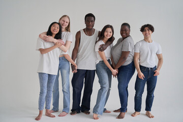 Diverse friends holding hands and hugging