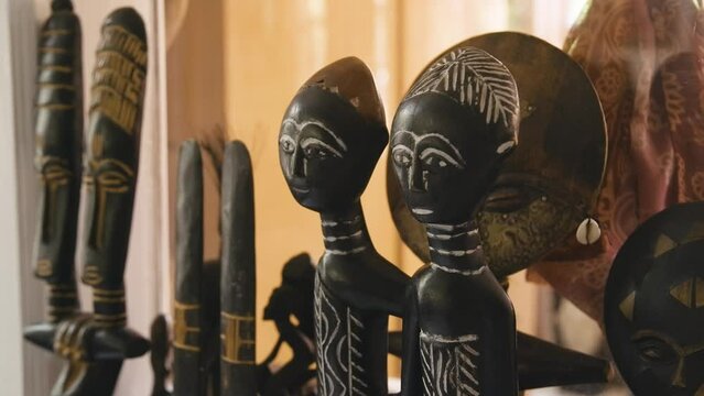 Black Stock Footage of historic African Art, Masks, Artifacts, and Sculptures in a home museum showcasing the diversity of African descendents, cultures, and creativity