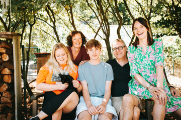 Family portrait of parents with teens in the garden