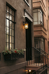 stone houses with glazed balconies and lantern in Brooklyn Heights district of New York City.