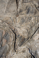 Natural texture of sand. Abstract beautiful drawings on the sand. Paintings in the sand
