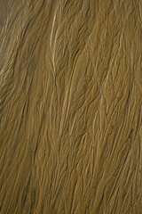 Natural texture of sand. Abstract beautiful drawings on the sand. Paintings in the sand
