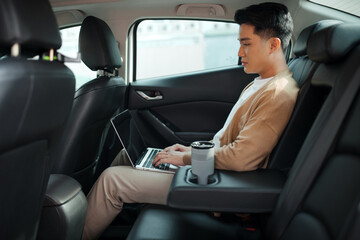 Handsome business man in car.