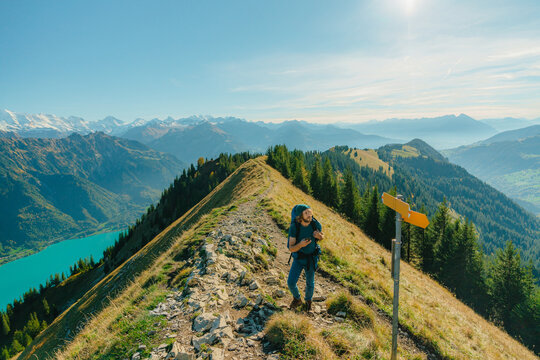 Man Hiking On Trail On The Background Of Interlaken In Switzerland