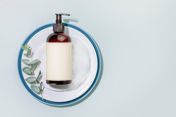 Mockup of dish detergent. Eco friendly natural cleaning dishes. Bottle with dish detergent on a...