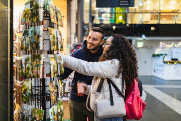 Happy couple looking at a souvenir shop