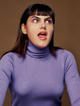 Surprised woman wearing a turtle neck