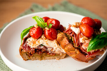 Sandwich with tomatoes and mozzarella.
cheese sandwich. Mozzarella sandwich.Sandwich with Iberica. 