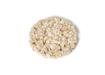 Round rice cake on a white isolated background. Crispy rice diet product for a healthy lifestyle. Close-up rice cake on a white background. Delicious low calorie snack