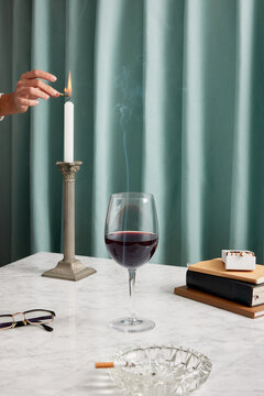 Bohemian composition with person lighting candle