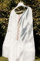 Bride Wedding Dress Gown Hangs On Tree Summer Spring Preparation Garden Vintage Boho Countryside Closeup Shot