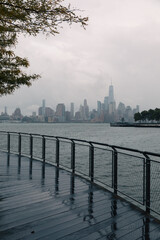 View of World Trade Center in and Hudson river during rainy weather in New York City.