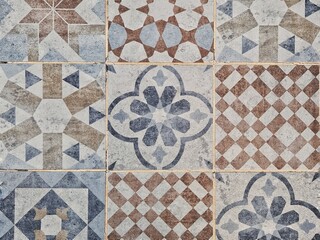 Vintage floor and wall tiles in different patterns and designs in pale blue, red, and white color	