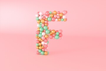 Letter F made of glass balls, pastel pearls, crystal jewels and gold.