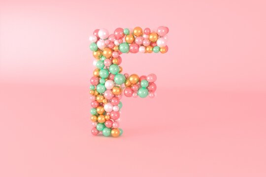 Letter F made of glass balls, pastel pearls, crystal jewels and gold.