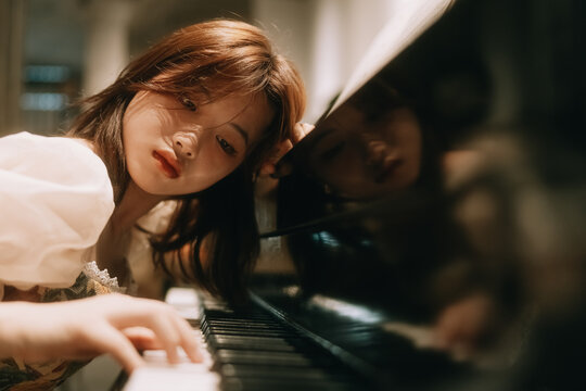 young woman playing piano