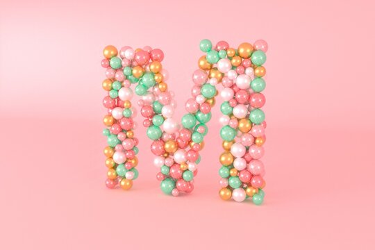 Letter M made of glass balls, pastel pearls, crystal jewels and gold.