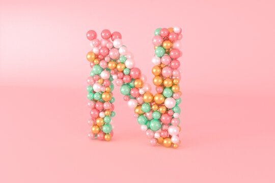 Letter N made of glass balls, pastel pearls, crystal jewels and gold.