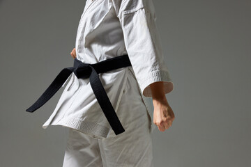 Woman in Karate uniform under blue light