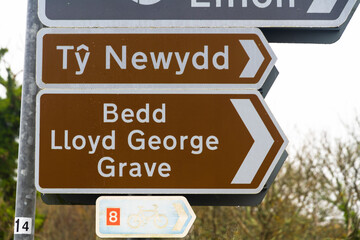 Sign for David Lloyd George grave in village of Llanystumdwy, Criccieth, landscape.
