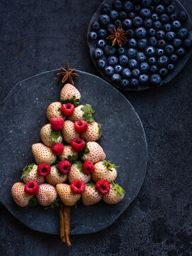 pineberry and raspberry Christmas tree with a blueberry sky