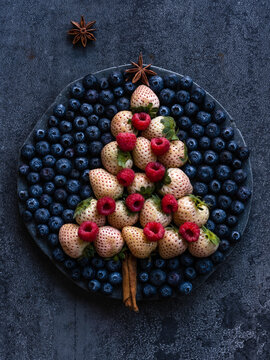 pineberry and raspberry Christmas tree with a blueberry sky