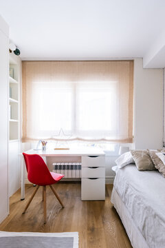 Cozy and bright bedroom with study desk modern design red chair