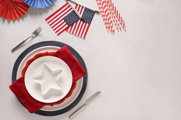 Patriotic table setting with USA flag and decoration on white background. Independence Day. Picnic...
