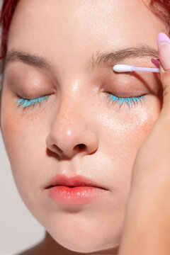 Close-up of a make-up artist's hand wiping off traces of make-up 