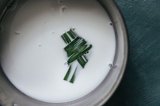 Pandan leaf cooking in coconut milk