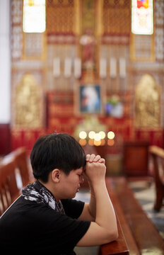 Closeup Asian woman in church, praying