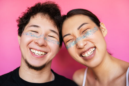 Cute Asian Couples  With Glitter On Face