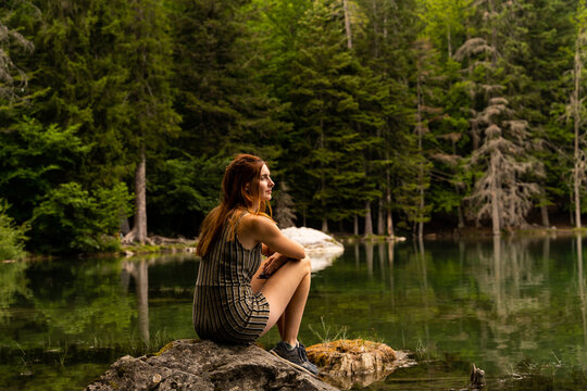 Woman relaxing in nature lake