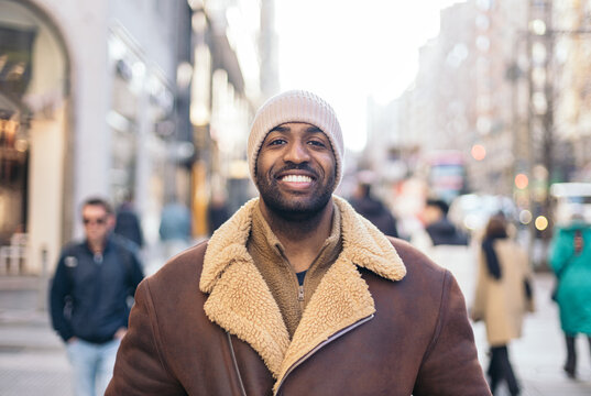 Portrait of a smiling black man wearing a beanie