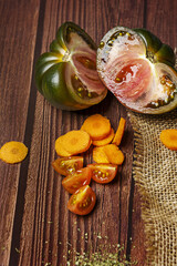 A wonderful and extraordinary sweet tomato marmalade cut in half with carrot slices and chopped cherry tomatoes