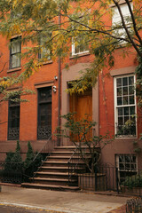 Fototapeta na wymiar Steps near entrance of house on street in New York City.