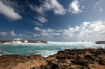 View of storm surf waves crashing into Laie Point rocky coastline at Kaawa on the North Shore of Oahu Hawaii United States